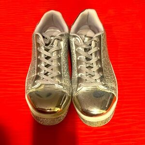 Size 8 sparkled silver fashion sneaker. So fun! Gently worn, great condition!